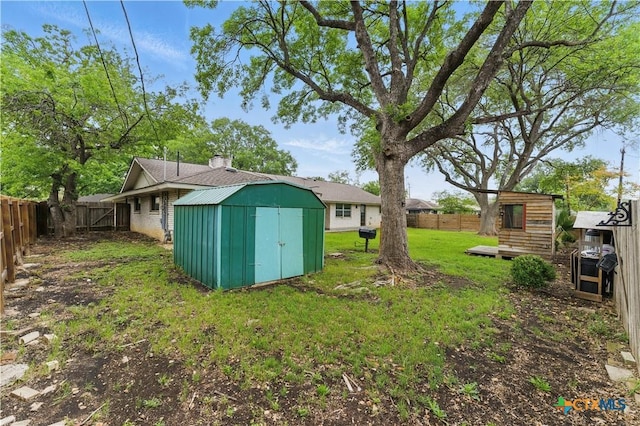 6022 Wildwind Dr, Windcrest, TX 78239 - view of yard featuring a storage unit and an outbuilding