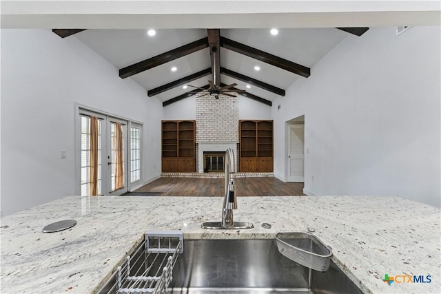 6022 Wildwind Dr, Windcrest, TX 78239 - kitchen with wood finished floors, open floor plan, light stone countertops, ceiling fan, and recessed lighting