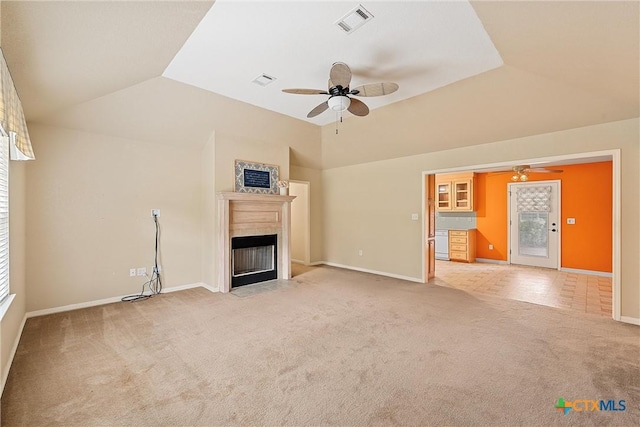 unfurnished living room with lofted ceiling, light carpet, and ceiling fan