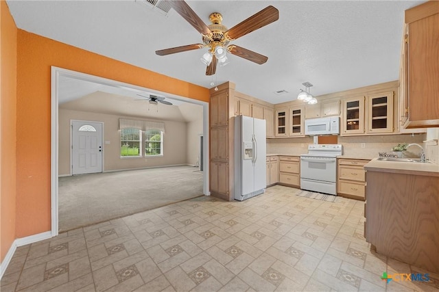 kitchen with light brown cabinetry, sink, backsplash, light colored carpet, and white appliances