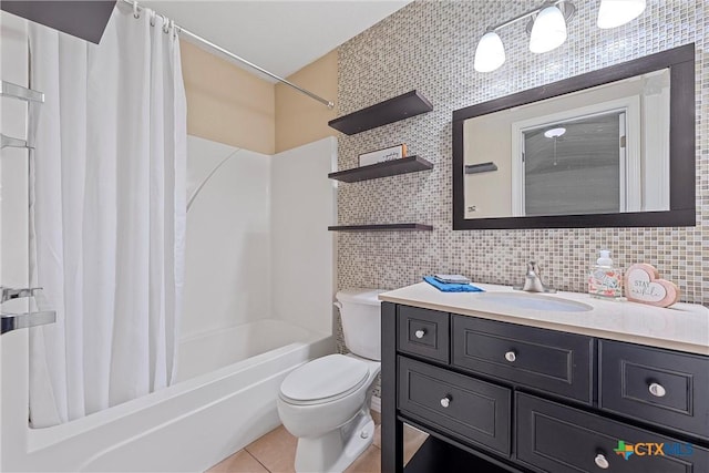 full bathroom with shower / tub combo with curtain, tile patterned floors, toilet, vanity, and decorative backsplash