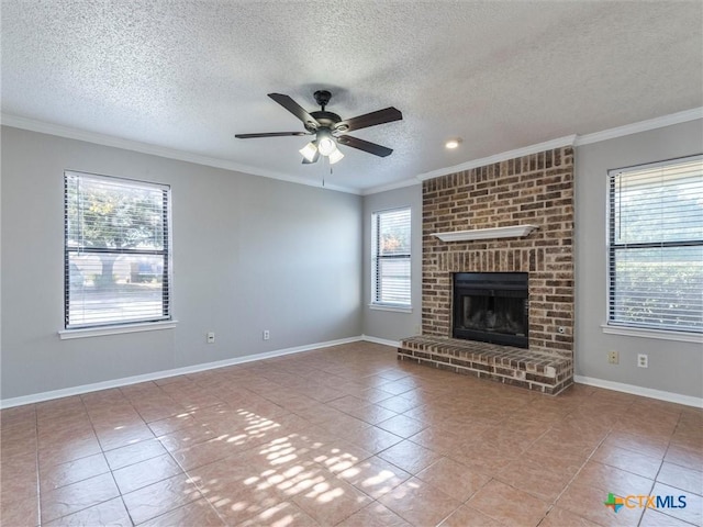 unfurnished living room featuring a fireplace, a healthy amount of sunlight, a textured ceiling, and ceiling fan