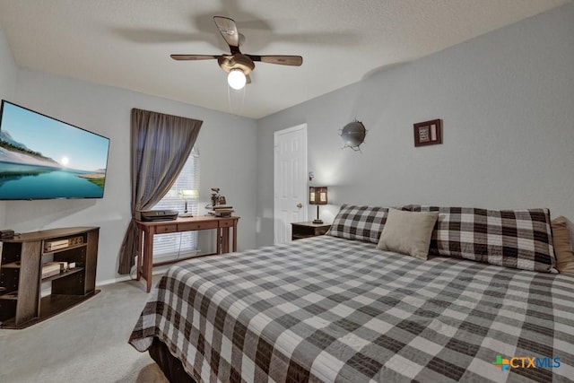 bedroom with ceiling fan and light carpet