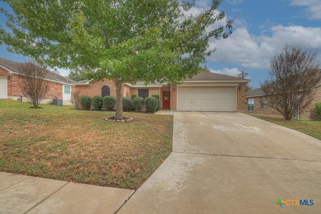 view of front facade with a garage and a front yard