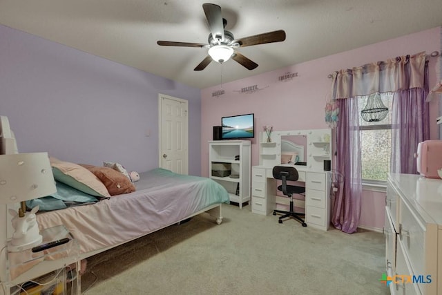 bedroom with ceiling fan and light colored carpet