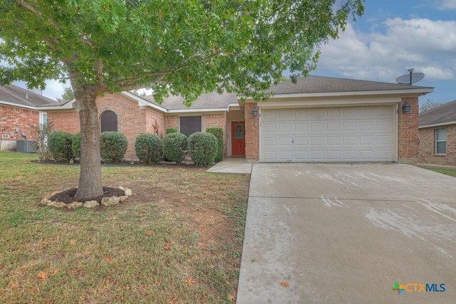 view of front of house featuring a garage and a front lawn