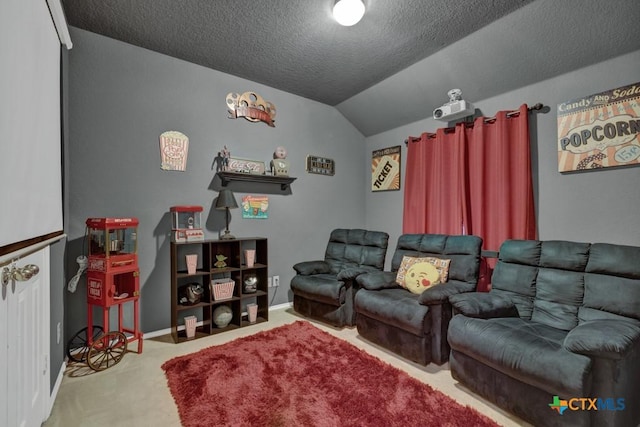 carpeted cinema featuring lofted ceiling and a textured ceiling