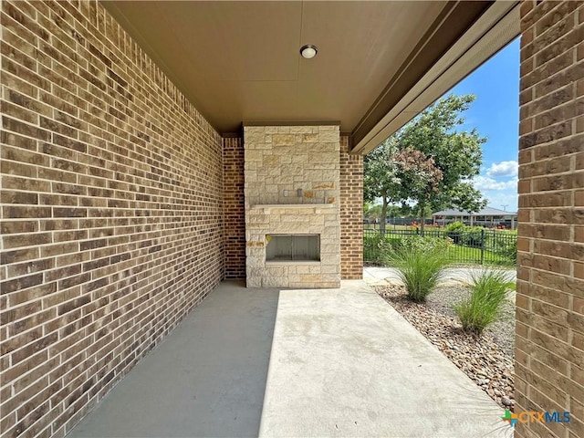 4316 Sunflower Ln, Temple, TX 76502 - view of patio featuring an outdoor stone fireplace