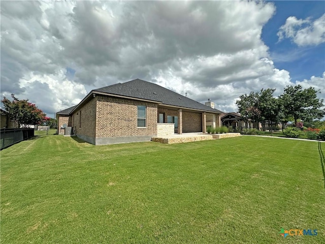 4316 Sunflower Ln, Temple, TX 76502 - back of property featuring brick siding and a garage