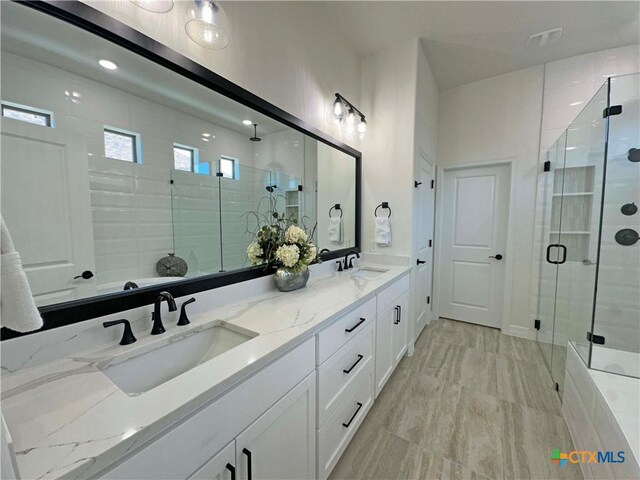 4316 Sunflower Ln, Temple, TX 76502 - bathroom featuring a shower stall and double vanity