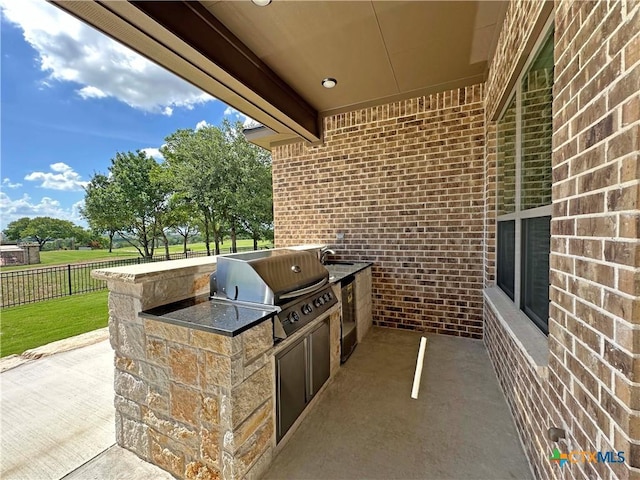 4316 Sunflower Ln, Temple, TX 76502 - view of patio / terrace featuring an outdoor kitchen and a sink