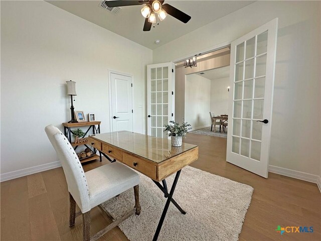 4316 Sunflower Ln, Temple, TX 76502 - living room with dark wood-type flooring, ceiling fan, a fireplace, and beamed ceiling