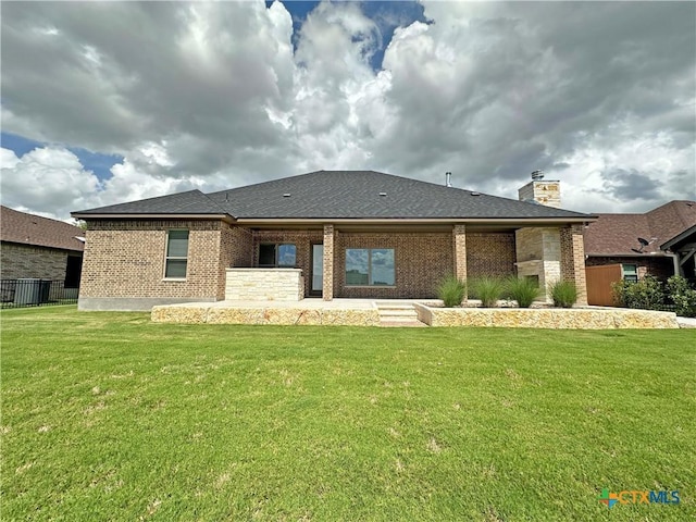 4316 Sunflower Ln, Temple, TX 76502 - rear view of house featuring brick siding and a chimney