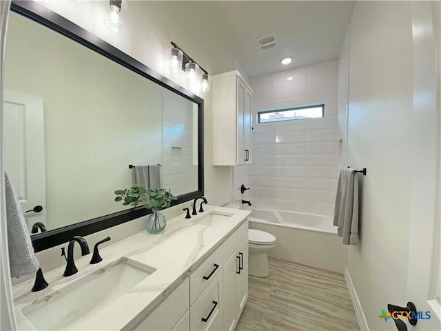 4316 Sunflower Ln, Temple, TX 76502 - bathroom with double vanity and washtub / shower combination
