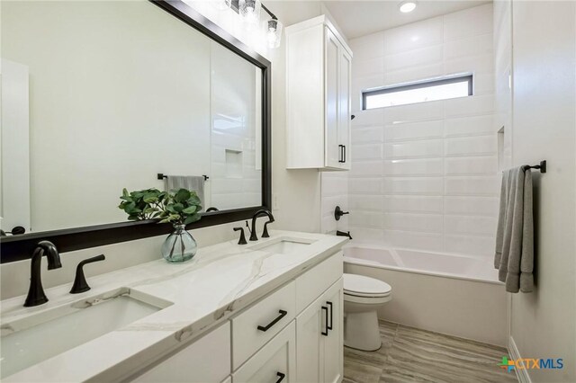 full bathroom with vanity, toilet, and shower / bathing tub combination