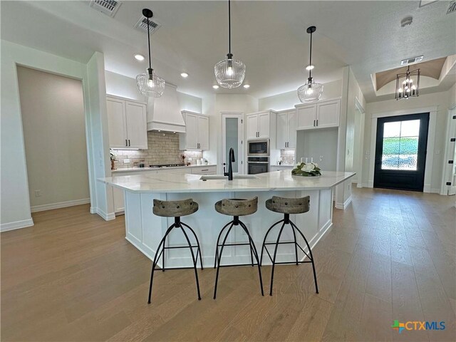 4316 Sunflower Ln, Temple, TX 76502 - unfurnished living room featuring a fireplace, wood finished floors, and a tray ceiling