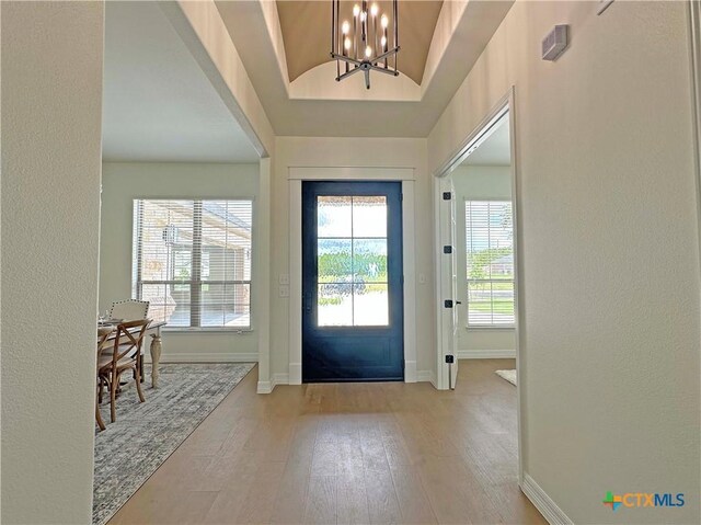4316 Sunflower Ln, Temple, TX 76502 - foyer entrance with a chandelier, hardwood / wood-style flooring, and vaulted ceiling