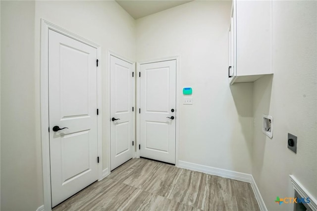 laundry room with washer hookup, cabinets, and hookup for an electric dryer