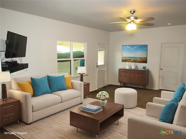 living room with ceiling fan and light colored carpet