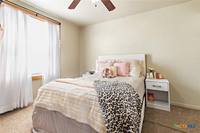 bedroom featuring carpet floors, baseboards, and a ceiling fan