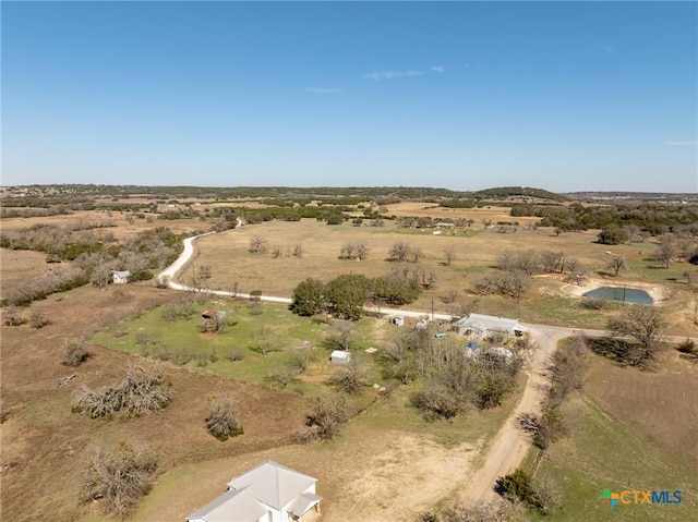 birds eye view of property with a rural view