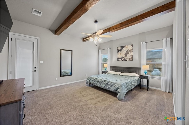 bedroom featuring beam ceiling, visible vents, baseboards, and carpet floors