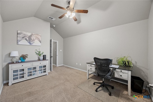 office space featuring visible vents, ceiling fan, baseboards, carpet, and lofted ceiling