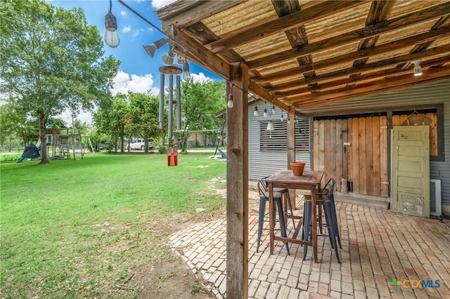 1004 Mitchell St, Gonzales, TX 78629 - view of green lawn featuring a patio