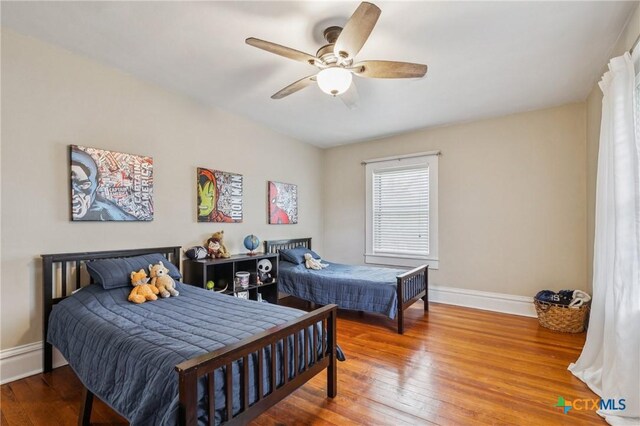 1004 Mitchell St, Gonzales, TX 78629 - bedroom with hardwood / wood-style floors and ceiling fan