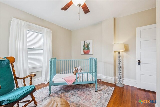 1004 Mitchell St, Gonzales, TX 78629 - bedroom featuring wood finished floors and ceiling fan