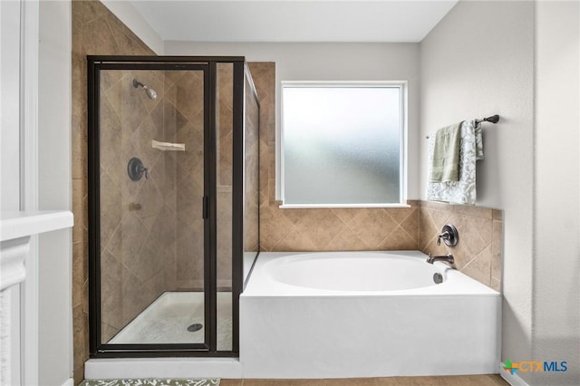 11602 Buster Crabbe Dr, Austin, TX 78748 - full bathroom featuring a garden tub and a stall shower