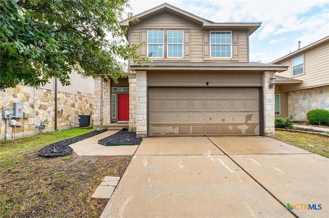 11602 Buster Crabbe Dr, Austin, TX 78748 - traditional home with stone siding, a garage, and driveway