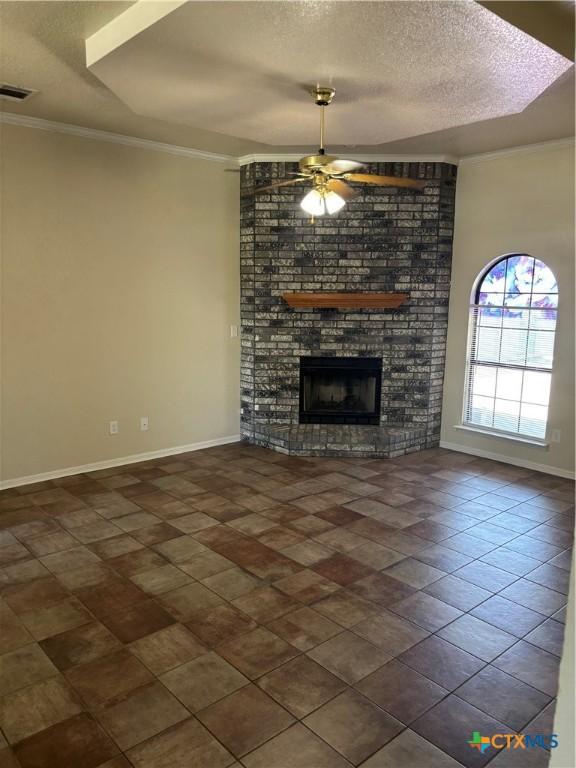 4207 Hitchrock Dr, Killeen, TX 76549 - unfurnished living room featuring crown molding, visible vents, baseboards, and a ceiling fan