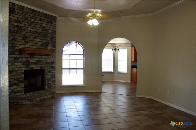 4207 Hitchrock Dr, Killeen, TX 76549 - unfurnished living room with baseboards, ornamental molding, a ceiling fan, a fireplace, and tile patterned floors