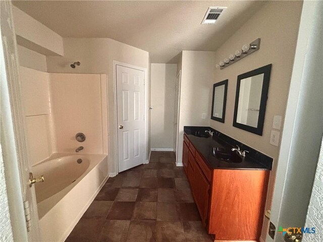 4207 Hitchrock Dr, Killeen, TX 76549 - full bathroom featuring a sink, visible vents, double vanity, and bathing tub / shower combination