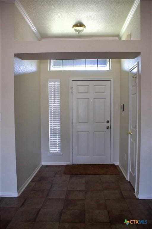 4207 Hitchrock Dr, Killeen, TX 76549 - foyer with crown molding, baseboards, and a textured ceiling