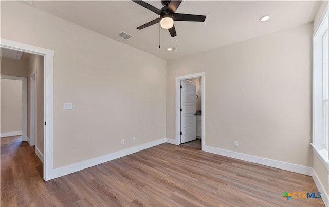 1435 Redwood Rd, Fischer, TX 78623 - unfurnished bedroom featuring wood finished floors, baseboards, recessed lighting, and ceiling fan
