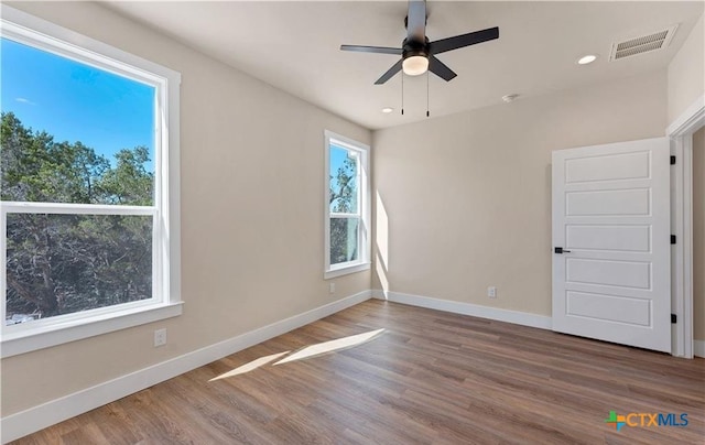 1435 Redwood Rd, Fischer, TX 78623 - unfurnished room featuring a ceiling fan, wood finished floors, baseboards, and recessed lighting