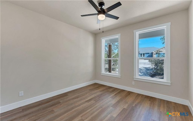 1435 Redwood Rd, Fischer, TX 78623 - empty room featuring baseboards, wood finished floors, and ceiling fan