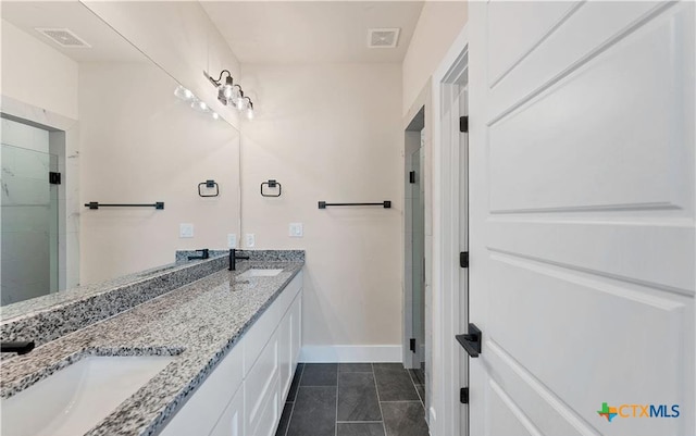 1435 Redwood Rd, Fischer, TX 78623 - full bathroom featuring baseboards, a stall shower, double vanity, and tile patterned flooring