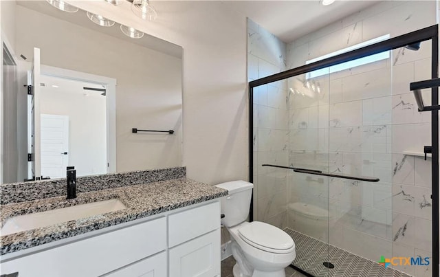 1435 Redwood Rd, Fischer, TX 78623 - bathroom featuring toilet, a stall shower, and vanity