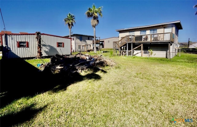 415 S 15th St, Port Oconnor, TX 77982 - view of yard featuring a wooden deck, stairway, and fence