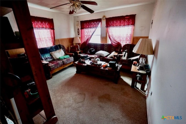 415 S 15th St, Port Oconnor, TX 77982 - interior space featuring wooden walls, a wainscoted wall, ceiling fan, and carpet floors