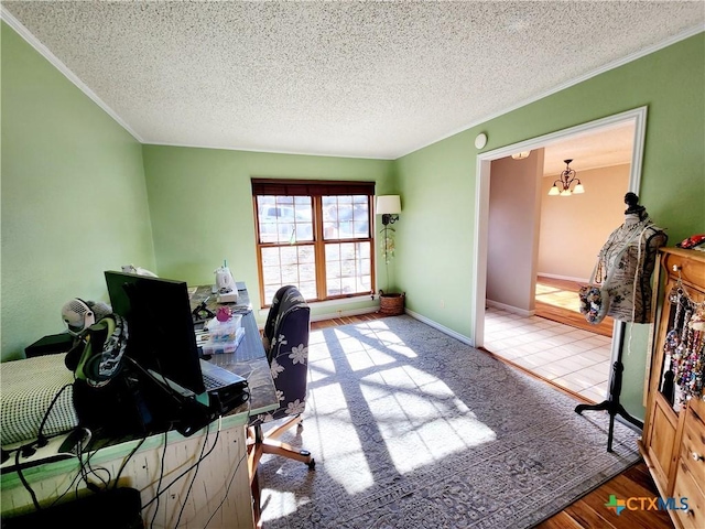 home office featuring a notable chandelier, light hardwood / wood-style floors, and a textured ceiling