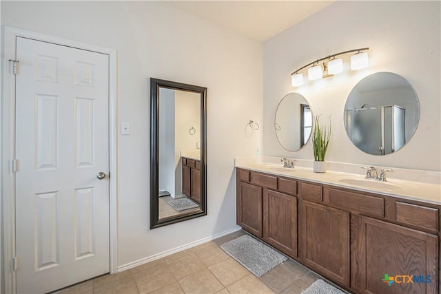 bathroom with vanity and tile patterned flooring