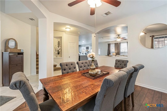 dining room featuring dark hardwood / wood-style floors and ceiling fan