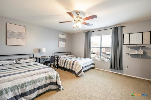 bedroom with ceiling fan and carpet