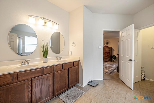 bathroom featuring tile patterned floors and vanity