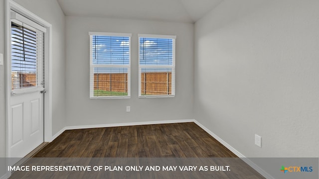 unfurnished room featuring dark wood-type flooring and vaulted ceiling