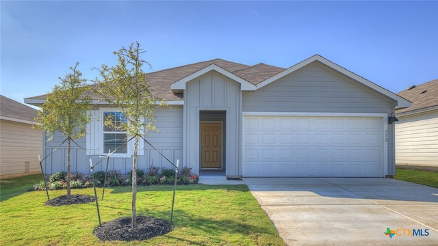 single story home with a garage and a front lawn